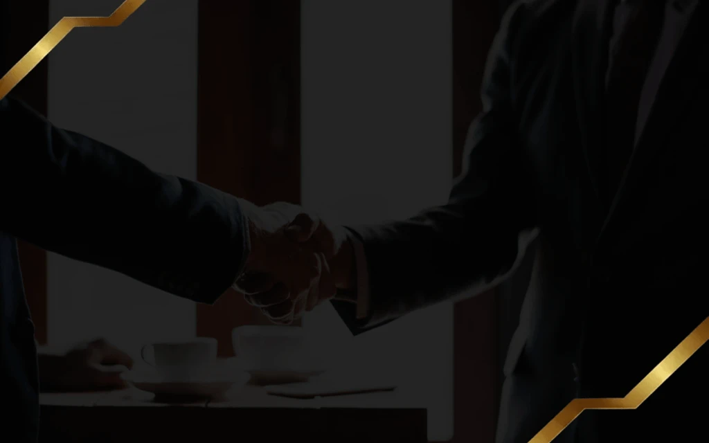 Hands shaking business contract